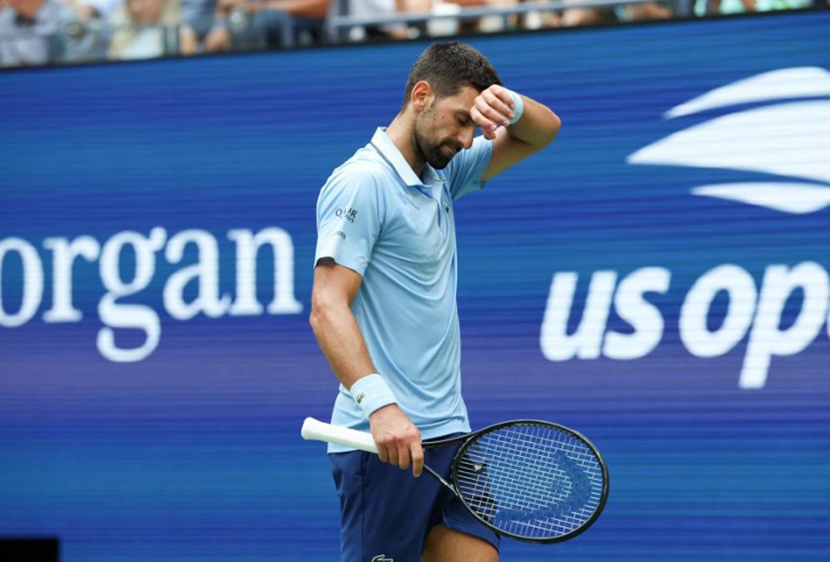 Serbia's Novak Djokovic gestures during the men's singles semifinal tennis match against Spain's Carlos Alcaraz on day thirteen of the US Open tennis tournament at the USTA Billie Jean King National Tennis Center in New York City, on September 5, 2025. TIMOTHY A. CLARY / AFP