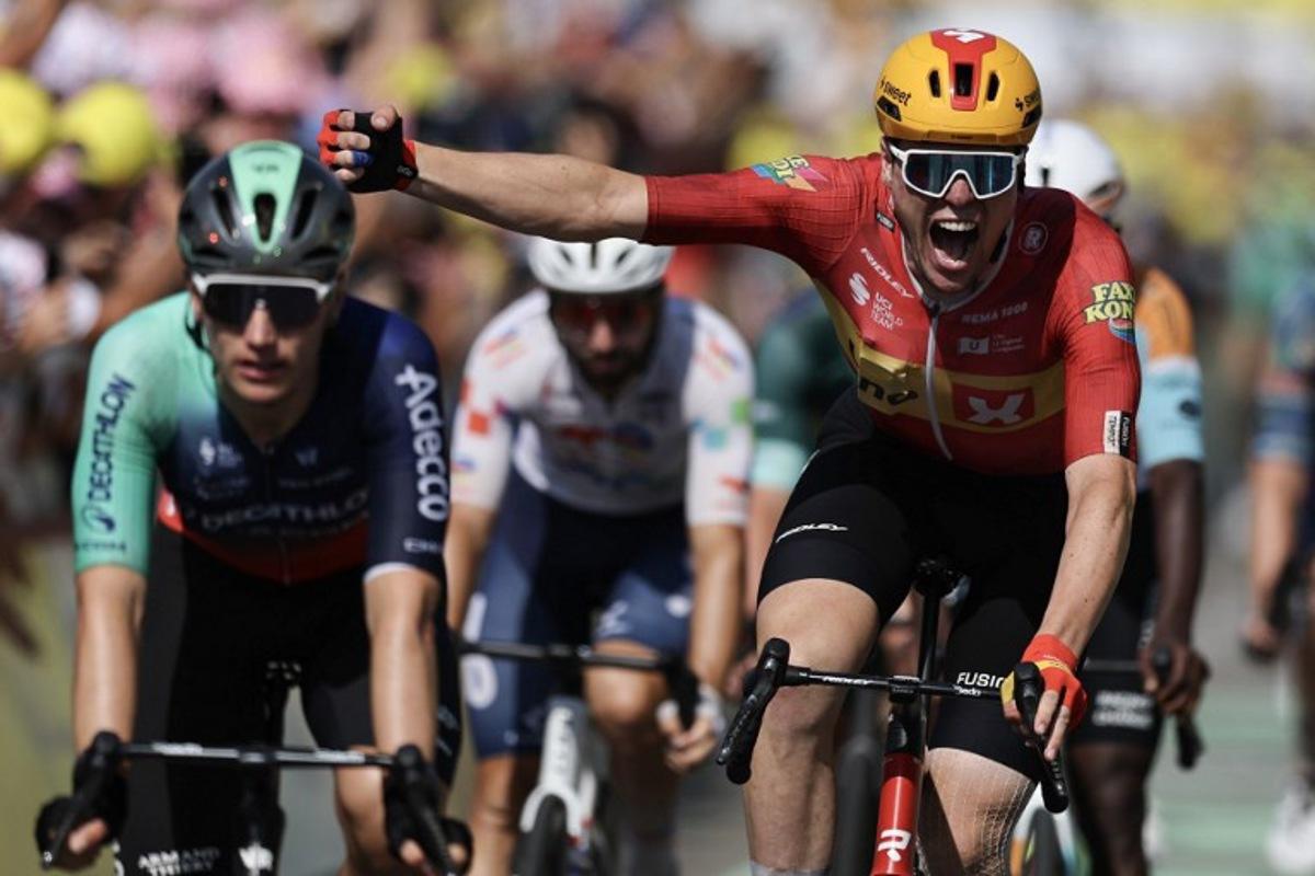 Uno-X Mobility team's Norwegian rider Soren Waerenskjold cycles to the finish line to win the 11th stage of the 113th edition of the Tour de France cycling race, 161,3 km between Vichy and Nevers in central France, on July 15, 2026. Anne-Christine POUJOULAT / AFP
