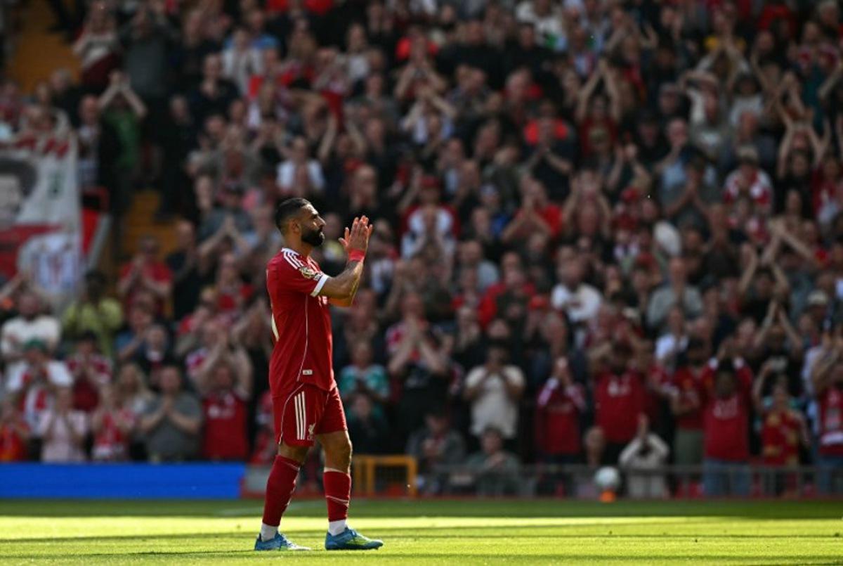 Liverpool's Egyptian striker #11 Mohamed Salah applauds the fans as he leaves the pitch injured during the English Premier League football match between Liverpool and Crystal Palace at Anfield in Liverpool, north west England on April 25, 2026. Paul ELLIS / AFP