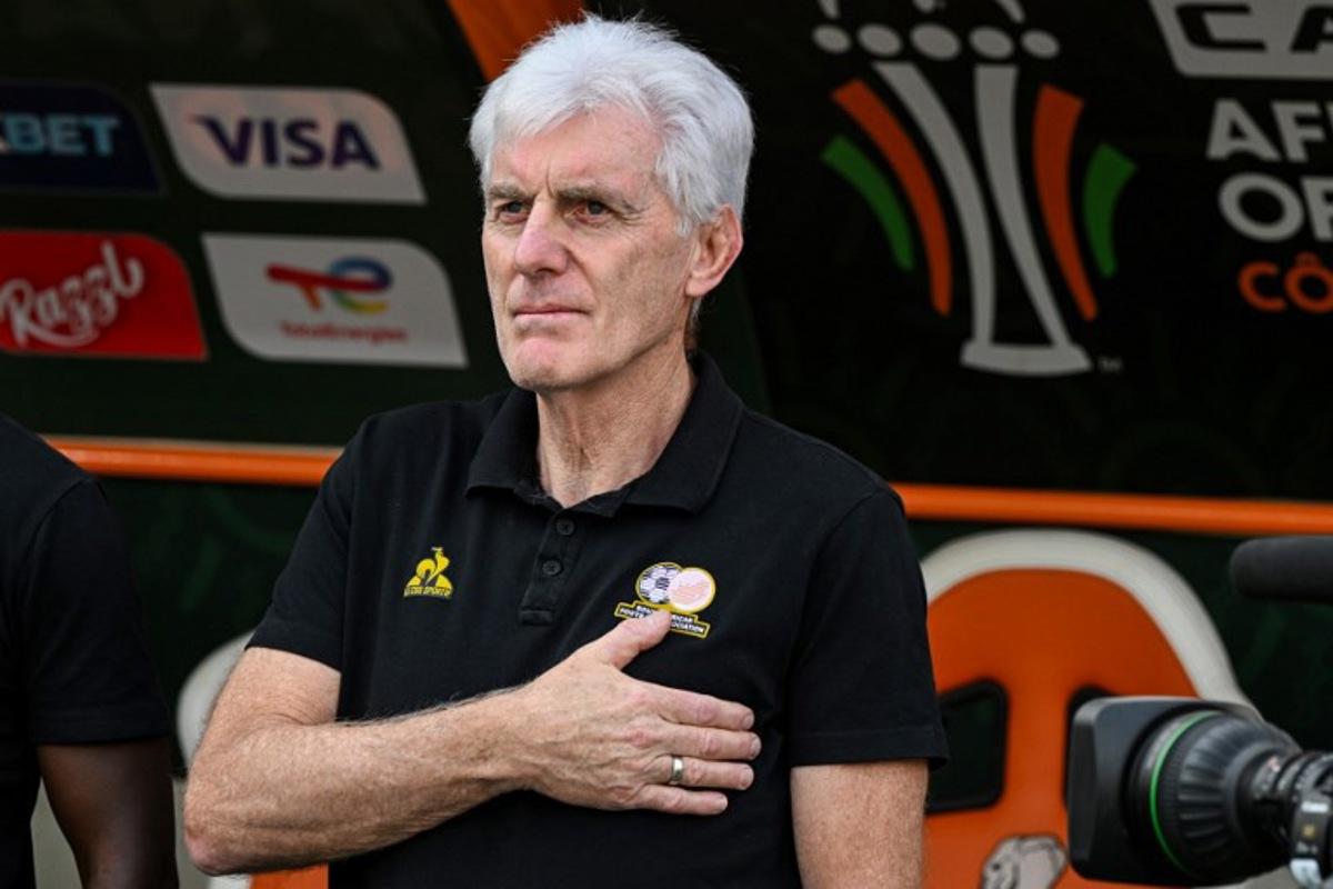 South Africa's head coach Hugo Broos gestures during the national anthem ahead of the Africa Cup of Nations (CAN) 2024 semi-final football match between Nigeria and South Africa at the Stade de la Paix in Bouake on February 7, 2024. Issouf SANOGO / AFP