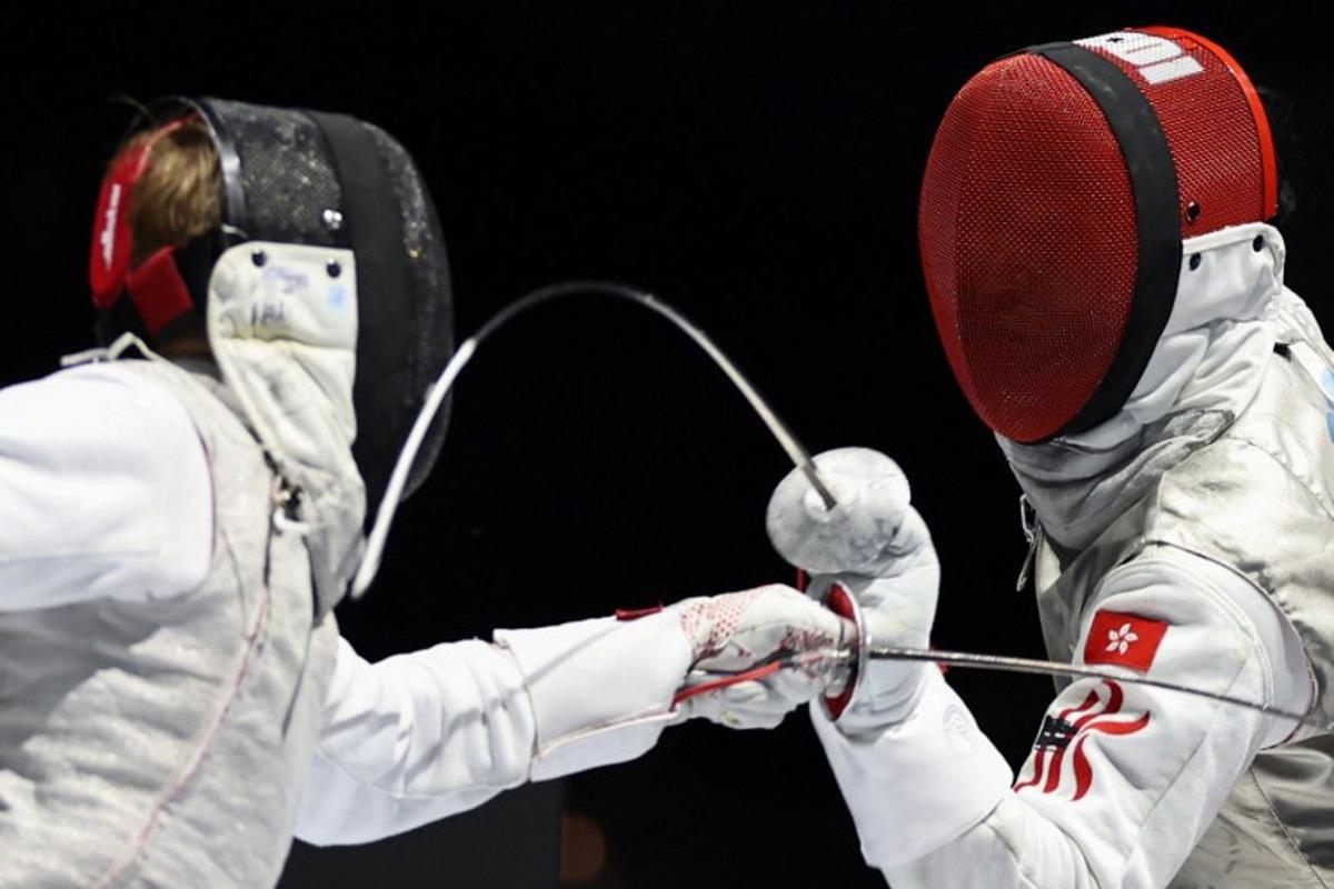 Individual Neutral Athlete Kirill Borodachev and Hong Kong's Choi Chun Yin Ryan compete in the men's foil individual gold medal bout during the FIE Fencing World Championships in Tbilisi on July 23, 2025. Giorgi ARJEVANIDZE / AFP