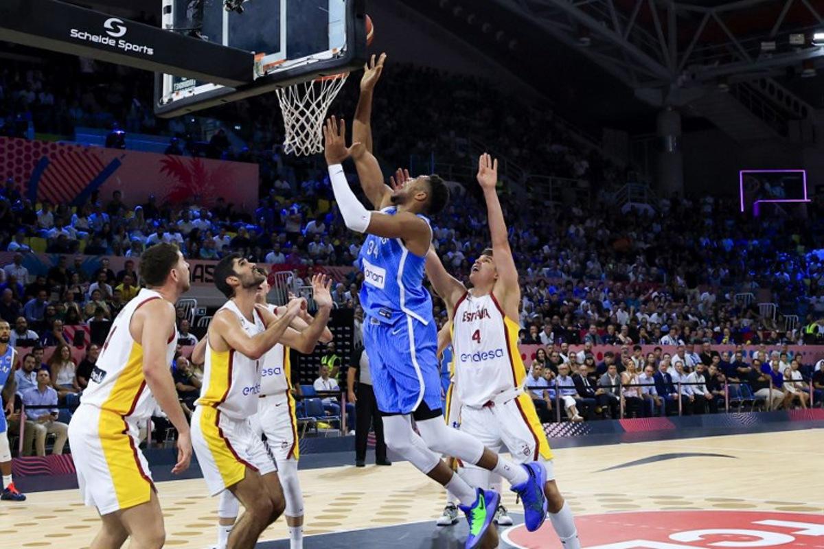 Greece's small forward #34 Giannis Antetokounmpo drives to the basket during the FIBA EuroBasket 2025 basketball match between Spain and Greece at Spyros Kyprianou Arena in Limassol on September 4, 2025. ALEX MITA / AFP