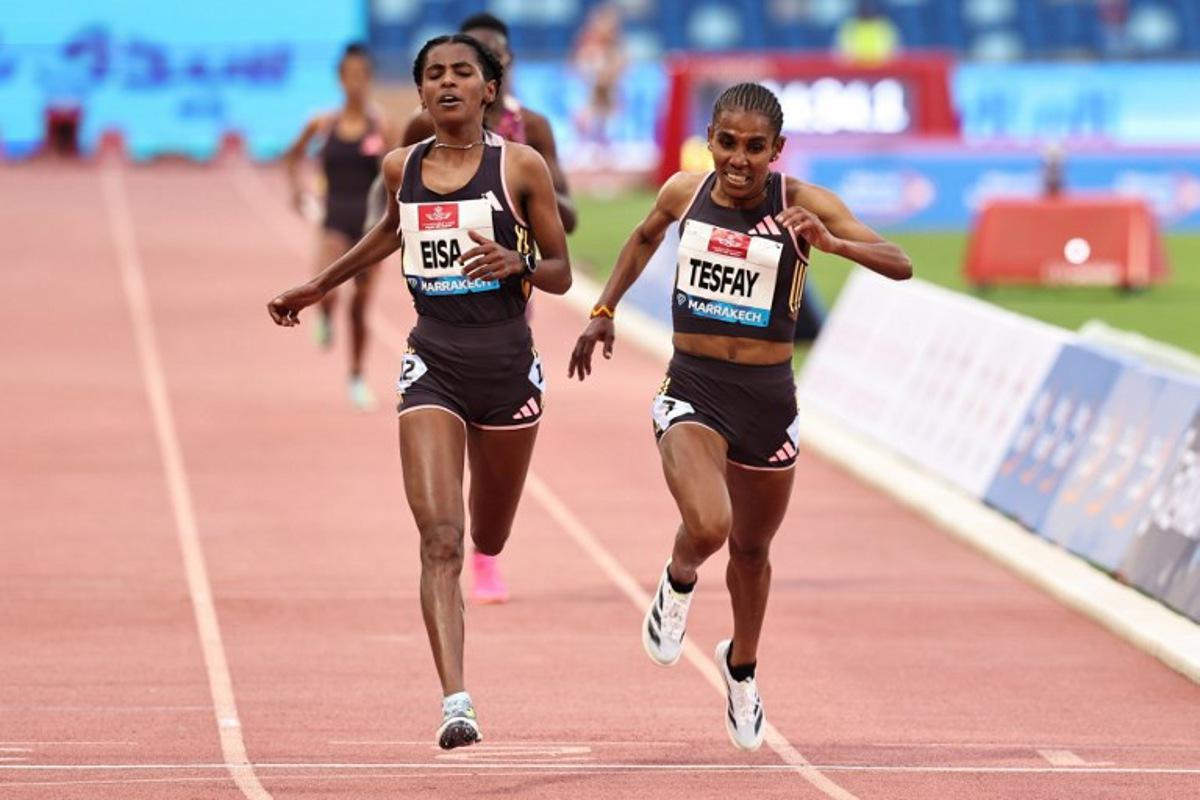 Ethiopia's Medina Eisa (L) and Fotyen Tesfay compete in the Women's 5000m during the IAAF Diamond League competition at the Grand Stadium in Marrakesh on May 19, 2024. FADEL SENNA / AFP