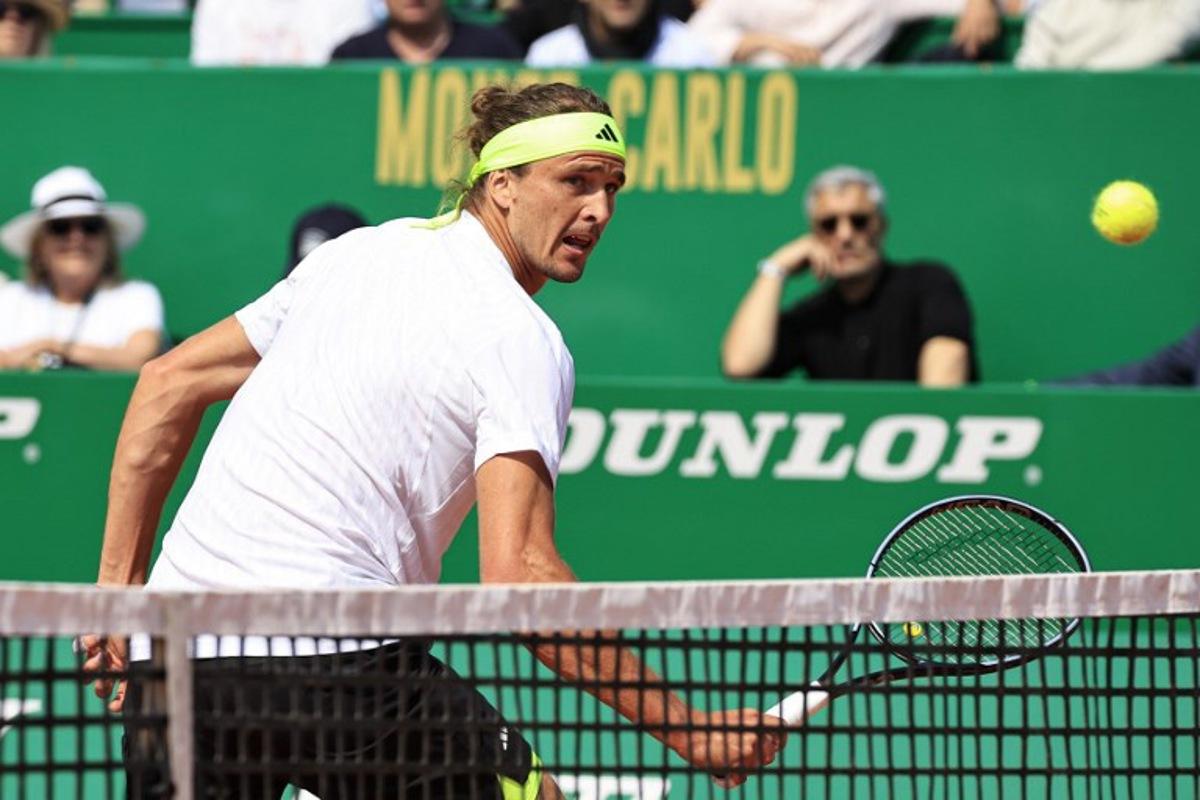 Germany's Alexander Zverev returns the ball to Italy's Matteo Berrettini during the Monte Carlo ATP Masters Series Tournament round of 32 tennis match on the Rainier III court at the Monte Carlo Country Club in Roquebrune-Cap-Martin on April 8, 2025. Valery HACHE / AFP
