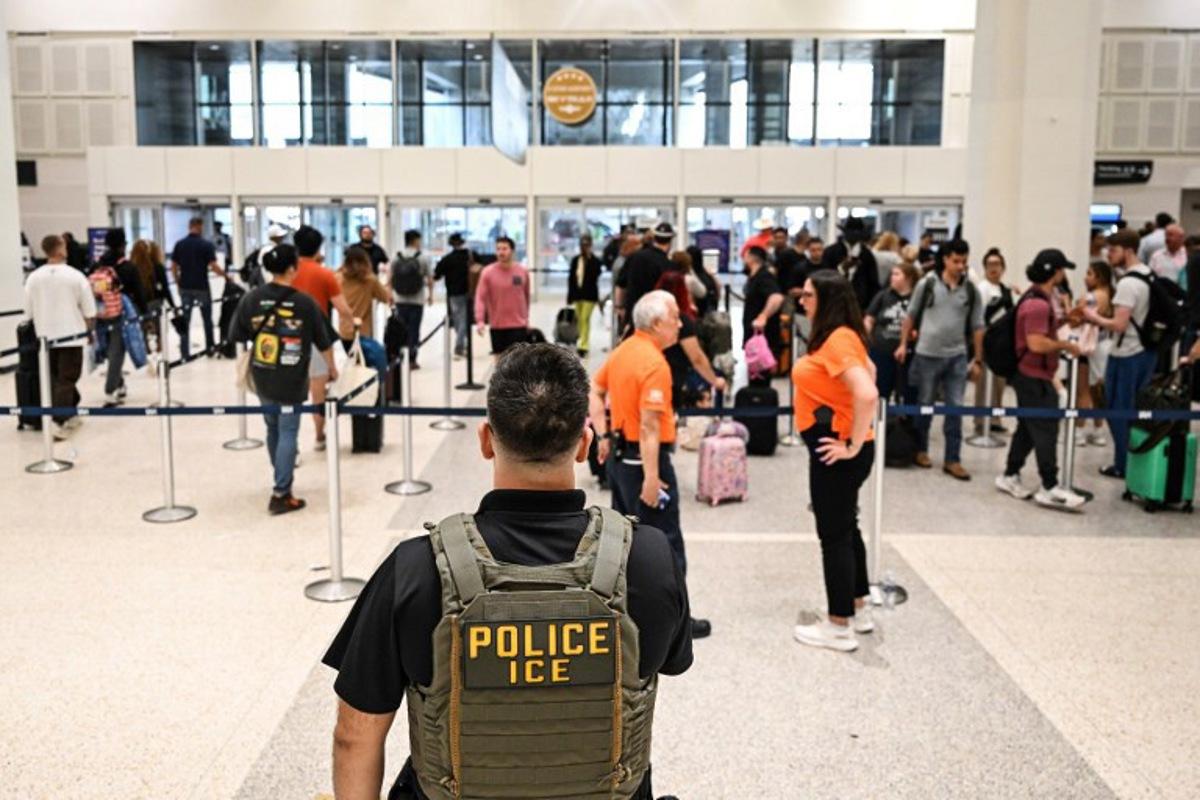 US Immigration and Customs Enforcement (ICE) are seem at George Bush Intercontinental Airport in Houston, Texas on March 23, 2026. RONALDO SCHEMIDT / AFP
