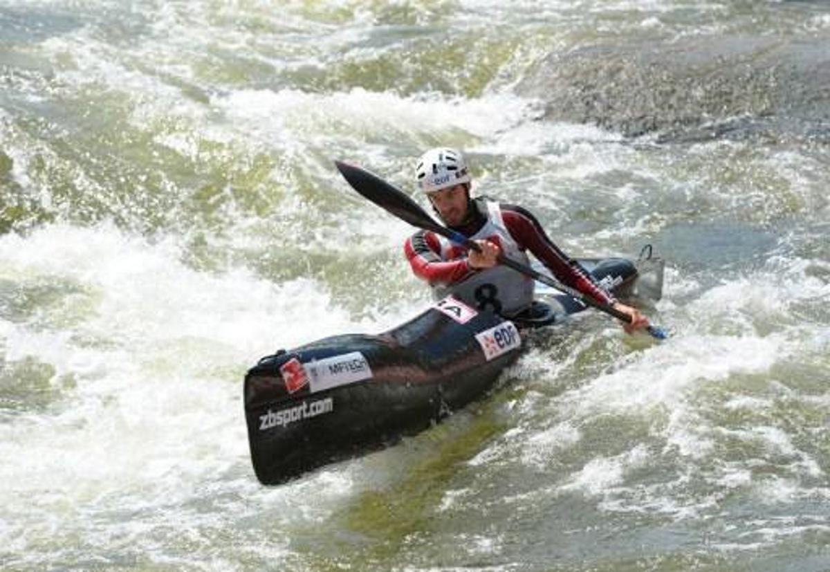 French Theo Devard competes in the Kayak K1 men race at the ICF Wildwater Canoeing Sprint World in the southern German city of Augsburg, on June 12, 2011. AFP PHOTO/CHRISTOF STACHE