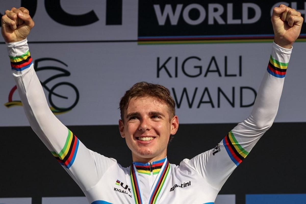 Gold medallist Italian rider Lorenzo Mark Finn celebrates on the podium following the men's U23 road race cycling event during the UCI 2025 Road World Championships, in Kigali, on September 26, 2025. Anne-Christine POUJOULAT / AFP
