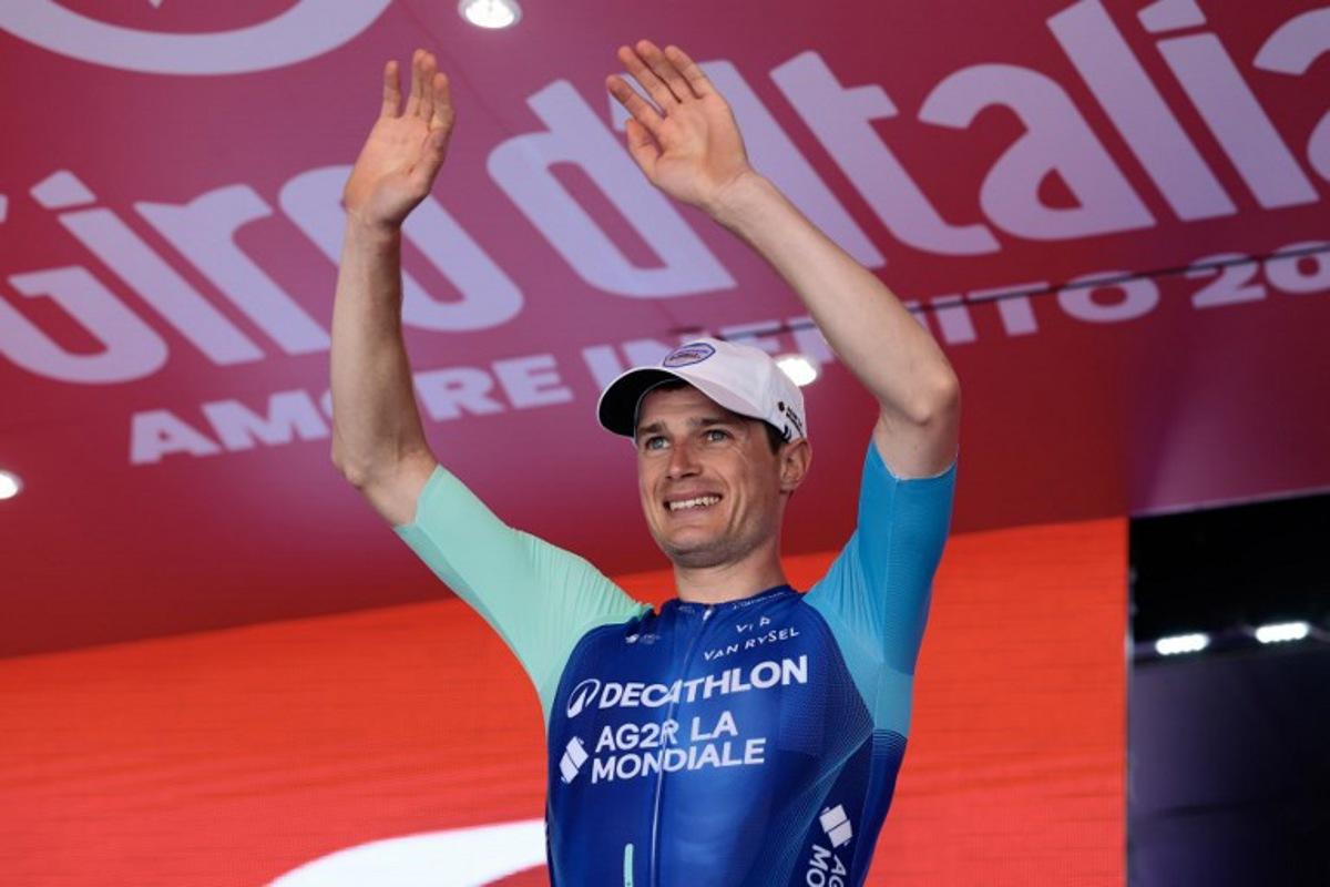 Decathlon AG2R La Mondiale Team's French rider Nicolas Prodhomme celebrates on the podium after victory in the 19th stage of the 108th Giro d'Italia cycling race of 166kms from Biella to Champoluc on May 30, 2025. Luca Bettini / AFP