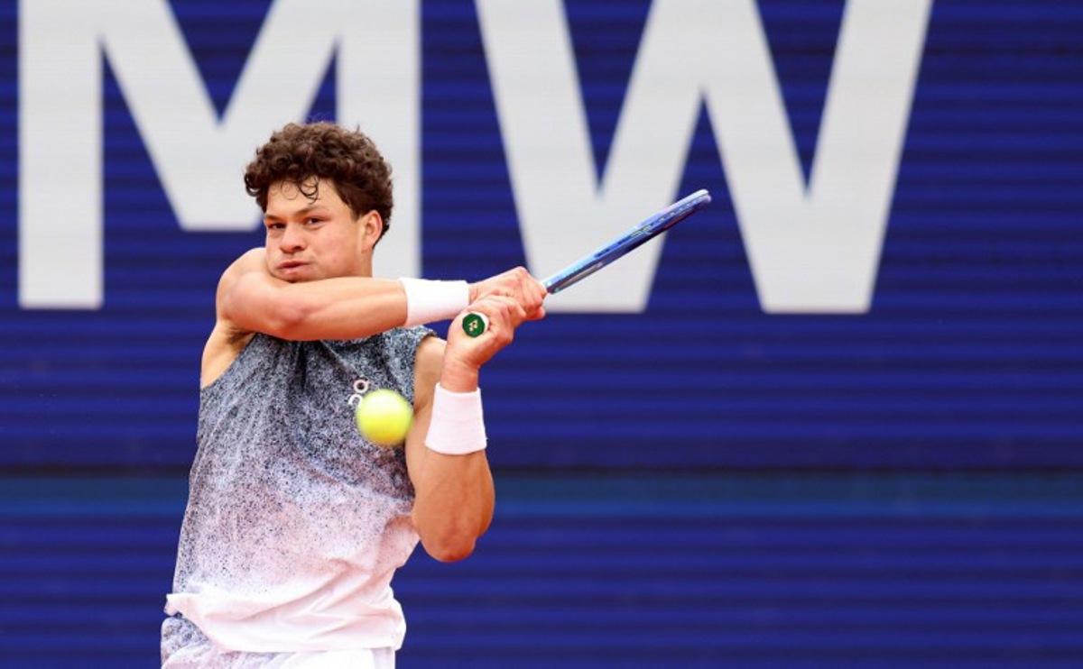 US' Ben Shelton returns the ball to Italy's Flavio Cobolli (not in picture) during the men's singles final match at the ATP Munich Open tennis tournament in Munich, southern Germany on April 19, 2026. Alexandra BEIER / AFP