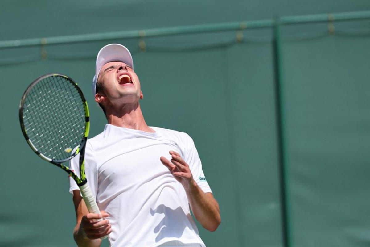 Britain's Oliver Tarvet reacts as he plays against Switzerland's Leandro Riedi during their men's singles first round tennis match on the first day of the 2025 Wimbledon Championships at The All England Lawn Tennis and Croquet Club in Wimbledon, southwest London, on June 30, 2025. Adrian Dennis / AFP