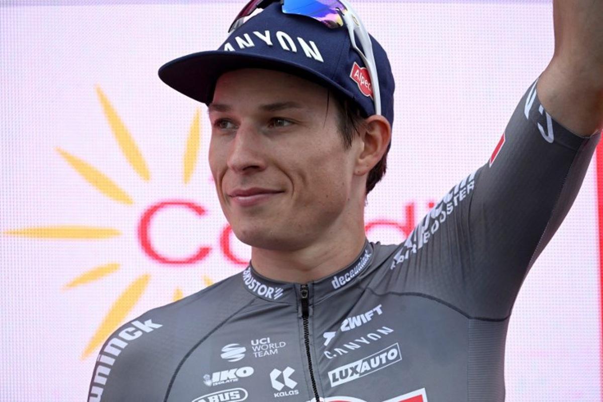 Stage winner team Alpecin's Belgian rider Jasper Philipsen celebrates on the podium after the 19th stage of the Vuelta a Espana, a 159 km race between Rueda and Guijuelo, on September 12, 2025. Miguel RIOPA / AFP