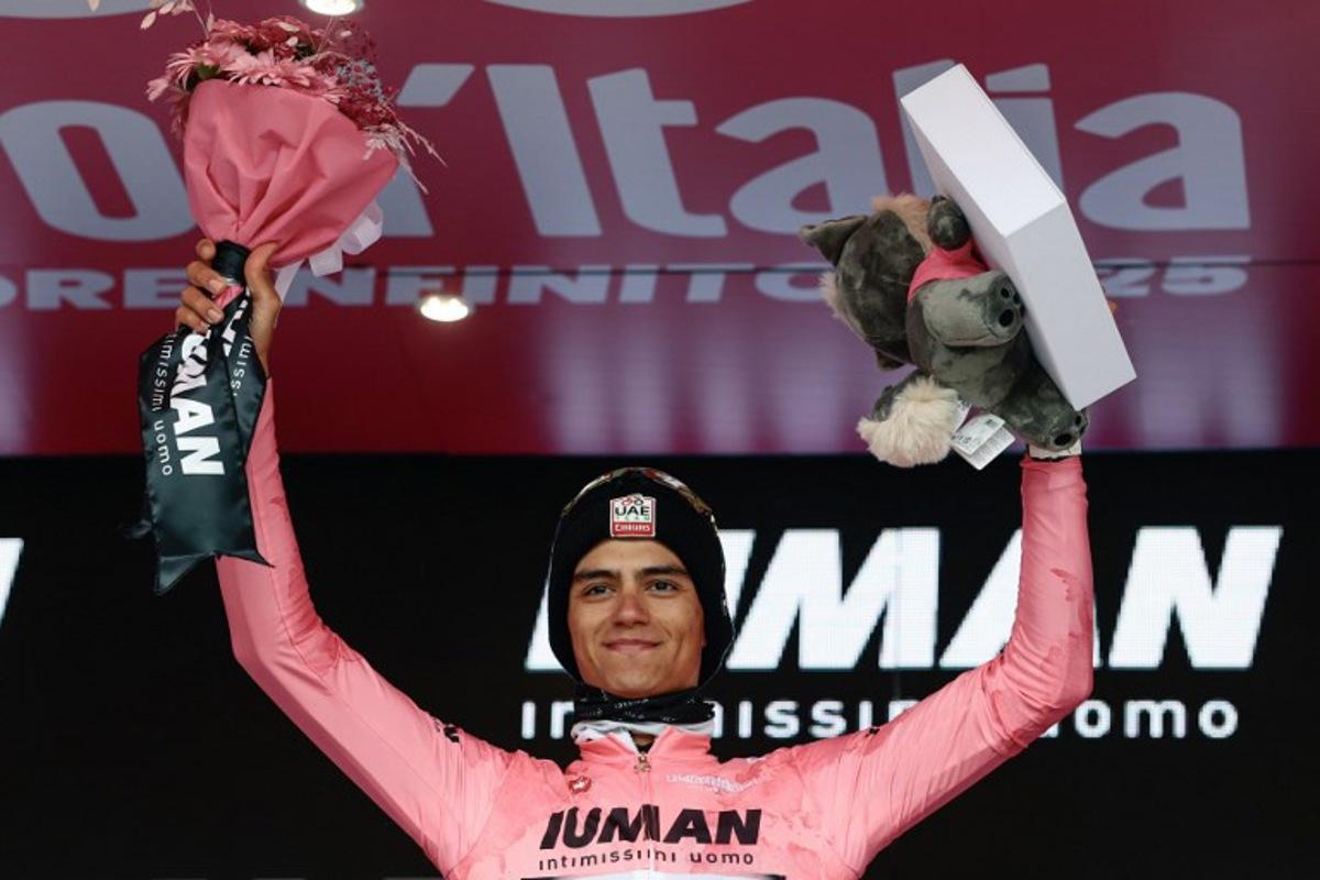 UAE Team Emirates XRG's Mexican rider Isaac Del Toro wearing the pink jersey of overall leader (Maglia Rosa) celebrates on the podium after the 14th stage of the 108th Giro d'Italia cycling race of 195kms from Treviso in Italy to Nova Gorica in Slovenia on May 24, 2025. Luca Bettini / AFP