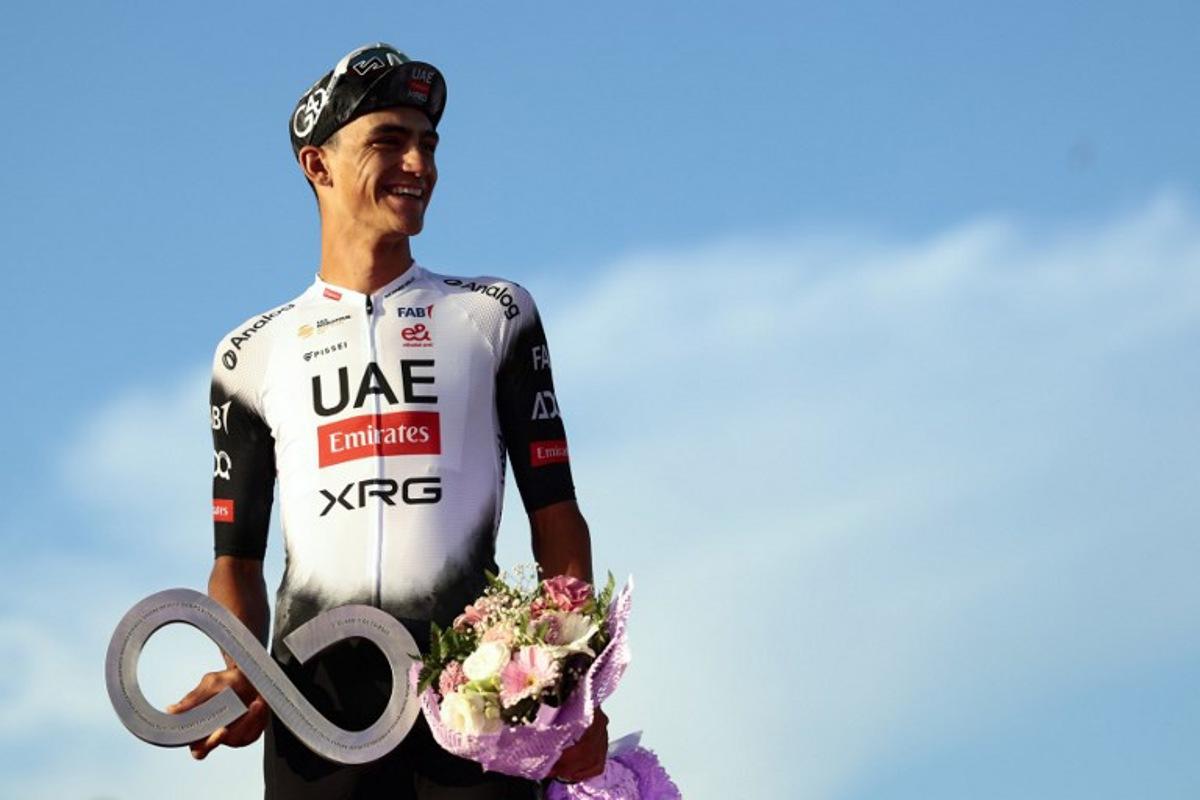Second placed UAE Team Emirates XRG's Mexican rider Isaac Del Toro celebrates on the podium at the end of the 21st and last stage of the 108th Giro d'Italia cycling race of 143kms from Rome to Rome on June 1, 2025. Luca Bettini / AFP