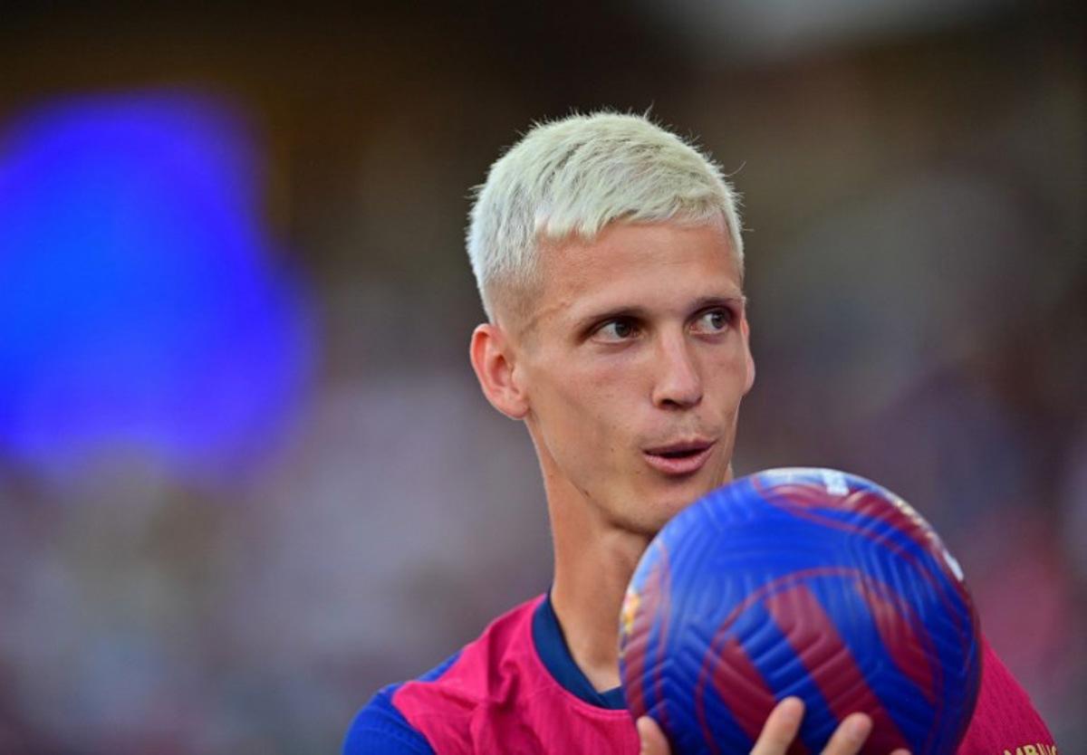 Barcelona's Spanish midfielder #20 Dani Olmo looks on during his presentation prior the 59th Joan Gamper Trophy football match between FC Barcelona and AS Monaco at the Estadi Olimpic Lluis Companys in Barcelona on August 12, 2024. MANAURE QUINTERO / AFP