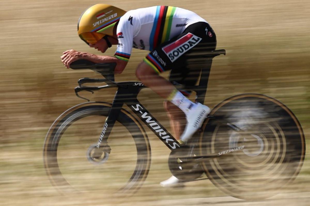 Soudal Quick-Step's Belgian rider Remco Evenepoel cycles during the 4th stage of the 77th edition of the Criterium du Dauphine cycling race, a 17,4 km individual time trial between Charmes-sur-Rhône and Saint-Péray, on June 11, 2025. Anne-Christine POUJOULAT / AFP