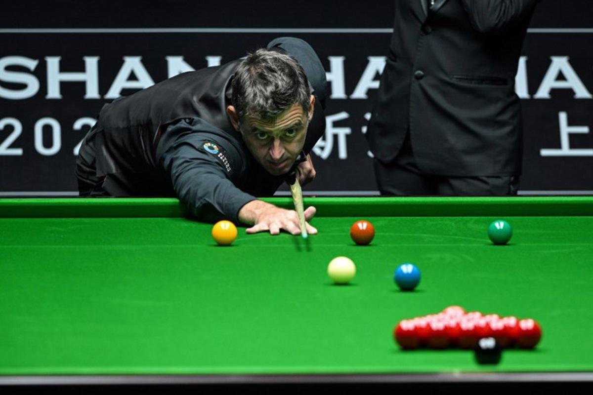 Britain's Ronnie O'Sullivan plays a shot during his match against Chinese Zhou Jinhao at the Shanghai Masters snooker tournament in Shanghai on July 16, 2024. Hector RETAMAL / AFP