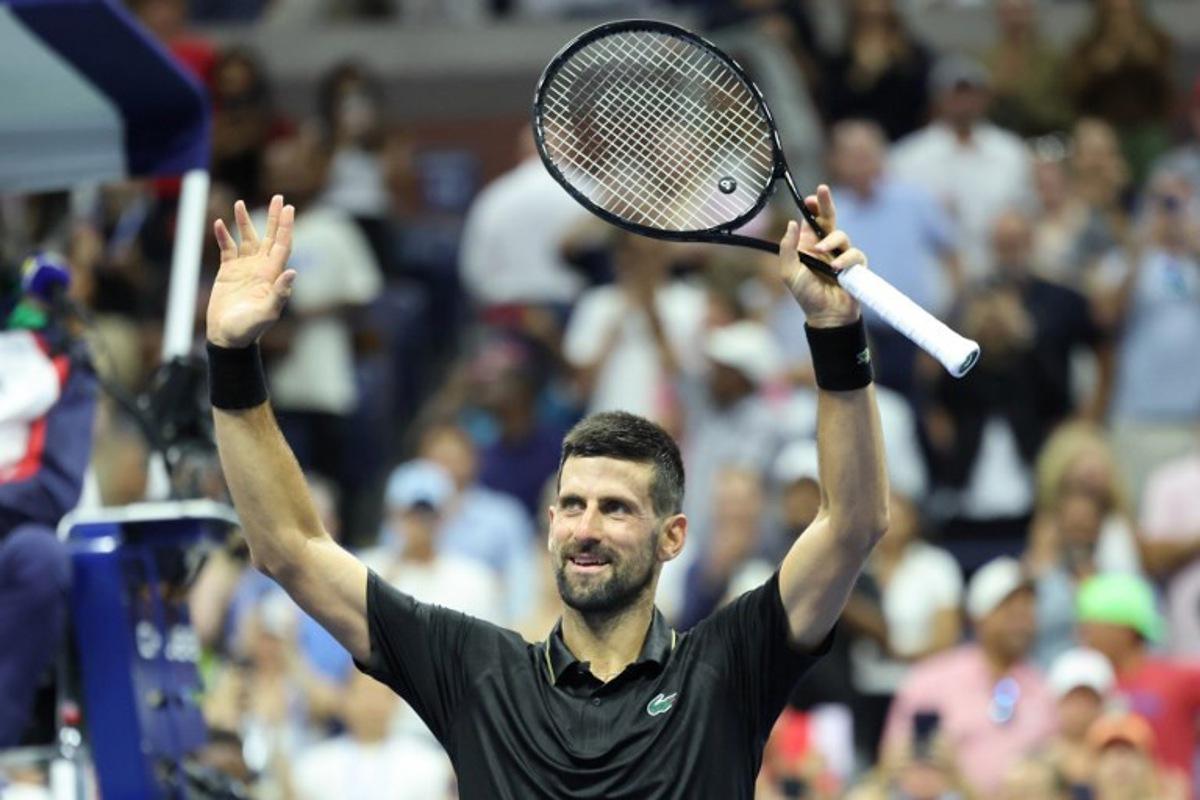 Serbia's Novak Djokovic celebrates after winning his men's singles first round tennis match against USA's Learner Tien on day one of the US Open tennis tournament at the USTA Billie Jean King National Tennis Center in New York City, on August 24, 2025. CHARLY TRIBALLEAU / AFP