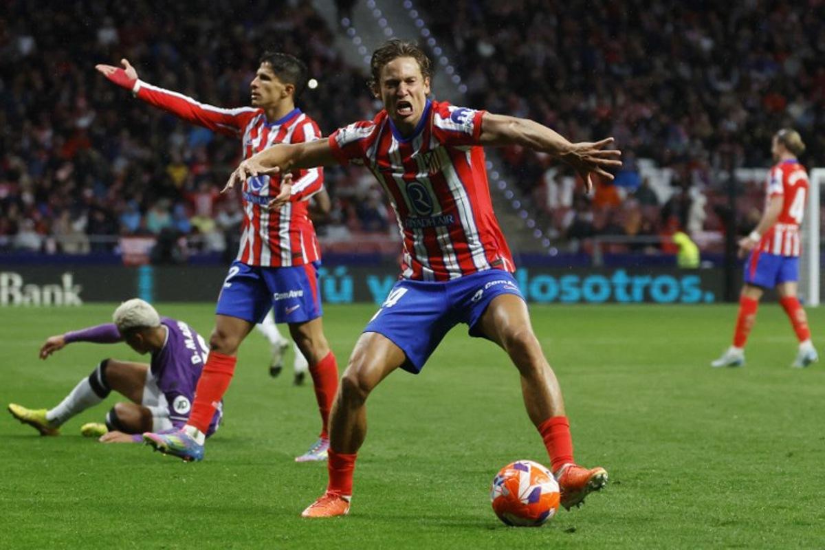 Atletico Madrid's Spanish midfielder #14 Marcos Llorente reacts during the Spanish league football match between Club Atletico de Madrid and Real Valladolid FC at Metropolitano Stadium in Madrid on April 14, 2025. Pierre-Philippe MARCOU / AFP