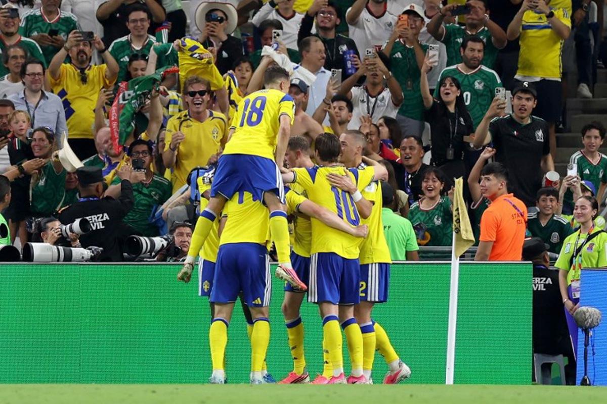 Sweden's forward #17 Viktor Gyokeres (unseen) celebrates with teammates scoring his team's third goal during the 2026 World Cup Group F football match between Sweden and Tunisia at the Monterrey Stadium in Guadalupe on June 14, 2026. Julio Cesar AGUILAR / AFP