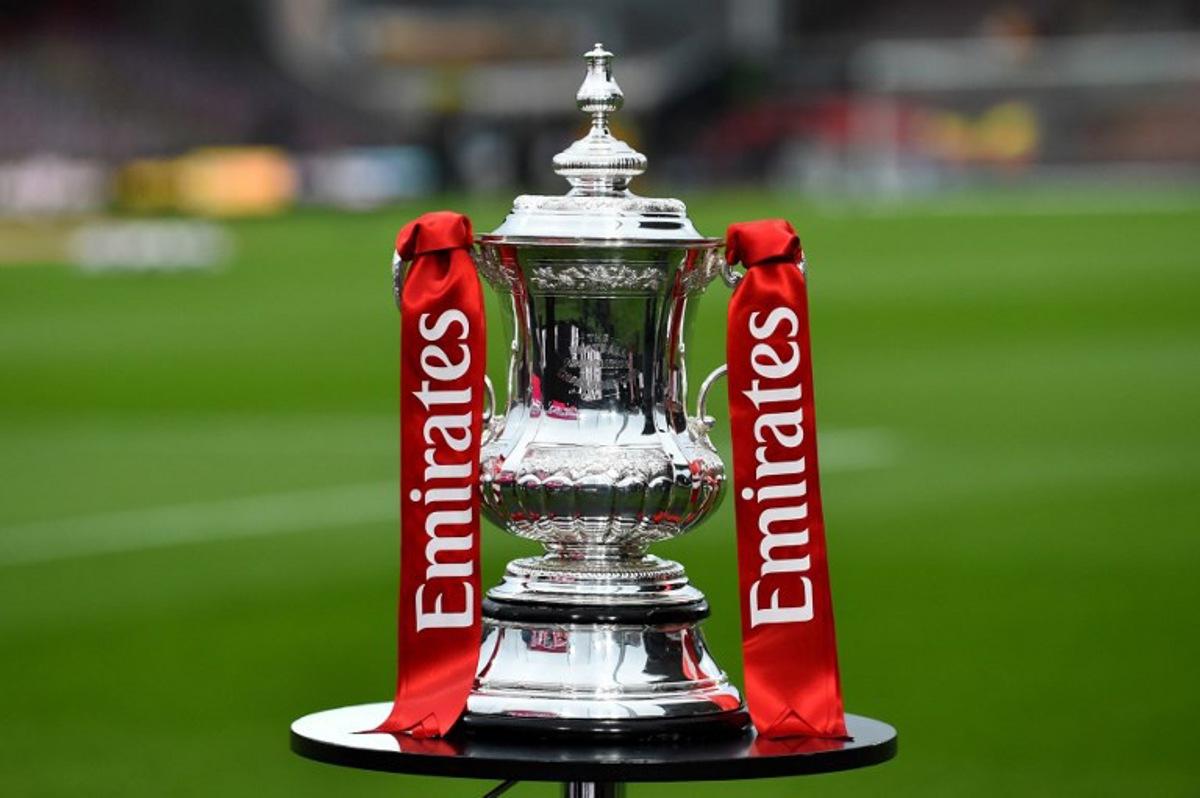 The FA Cup Trophy is displayed before the English FA Cup fifth round football match between Wrexham and Chelsea at the Racecourse Ground Stadium in Wrexham, north Wales, on March 7, 2026. PETER POWELL / AFP