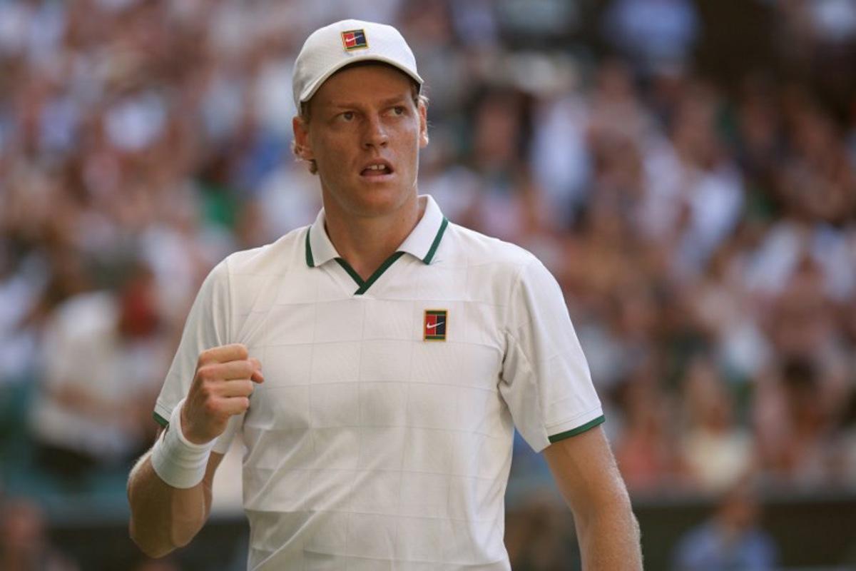 Italy's Jannik Sinner celebrates breaking the serve of Germany's Alexander Zverev during their men's singles final tennis match on the fourteenth day of the 2026 Wimbledon Championships at The All England Lawn Tennis and Croquet Club in Wimbledon, southwest London, on July 12, 2026. Henry NICHOLLS / AFP