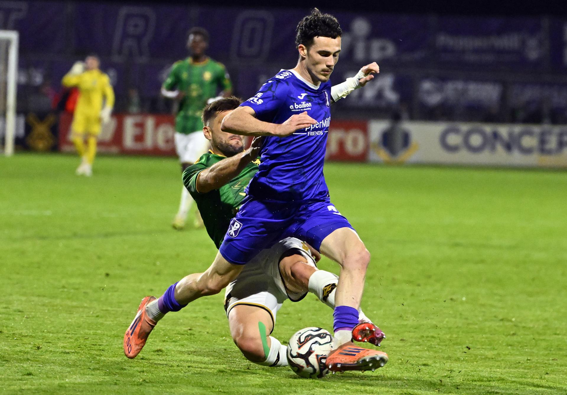 Francs Borains' Corenthyn Lavie and Patro Eisden's Milan Robberechts pictured in action during a soccer game between Patro Eisden Maasmechelen and Royal Francs Borains, Friday 17 April 2026 in Maasmechelen, on day 34 of the 2025-2026 'Challenger Pro League' 1B second division of the Belgian championship. BELGA PHOTO ERIC LALMAND