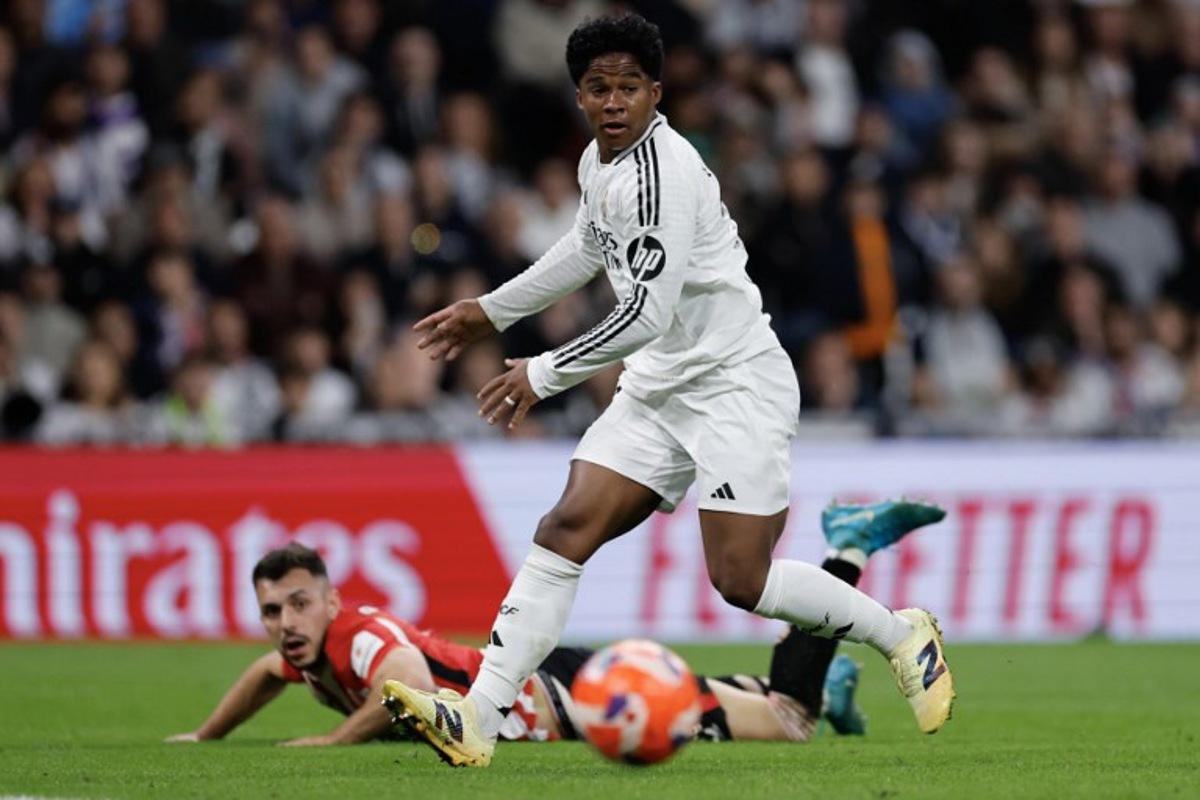 Real Madrid's Brazilian forward #16 Endrick watches the ball during the Spanish league football match between Real Madrid CF and Athletic Club Bilbao at the Santiago Bernabeu Stadium in Madrid, on April 20, 2025. OSCAR DEL POZO / AFP