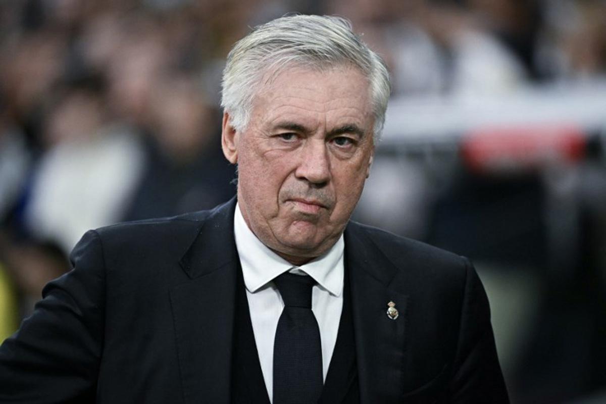 Real Madrid's Italian coach Carlo Ancelotti looks on before the Spanish league football match between Real Madrid CF and Valencia CF at the Santiago Bernabeu stadium in Madrid on April 5, 2025. JAVIER SORIANO / AFP