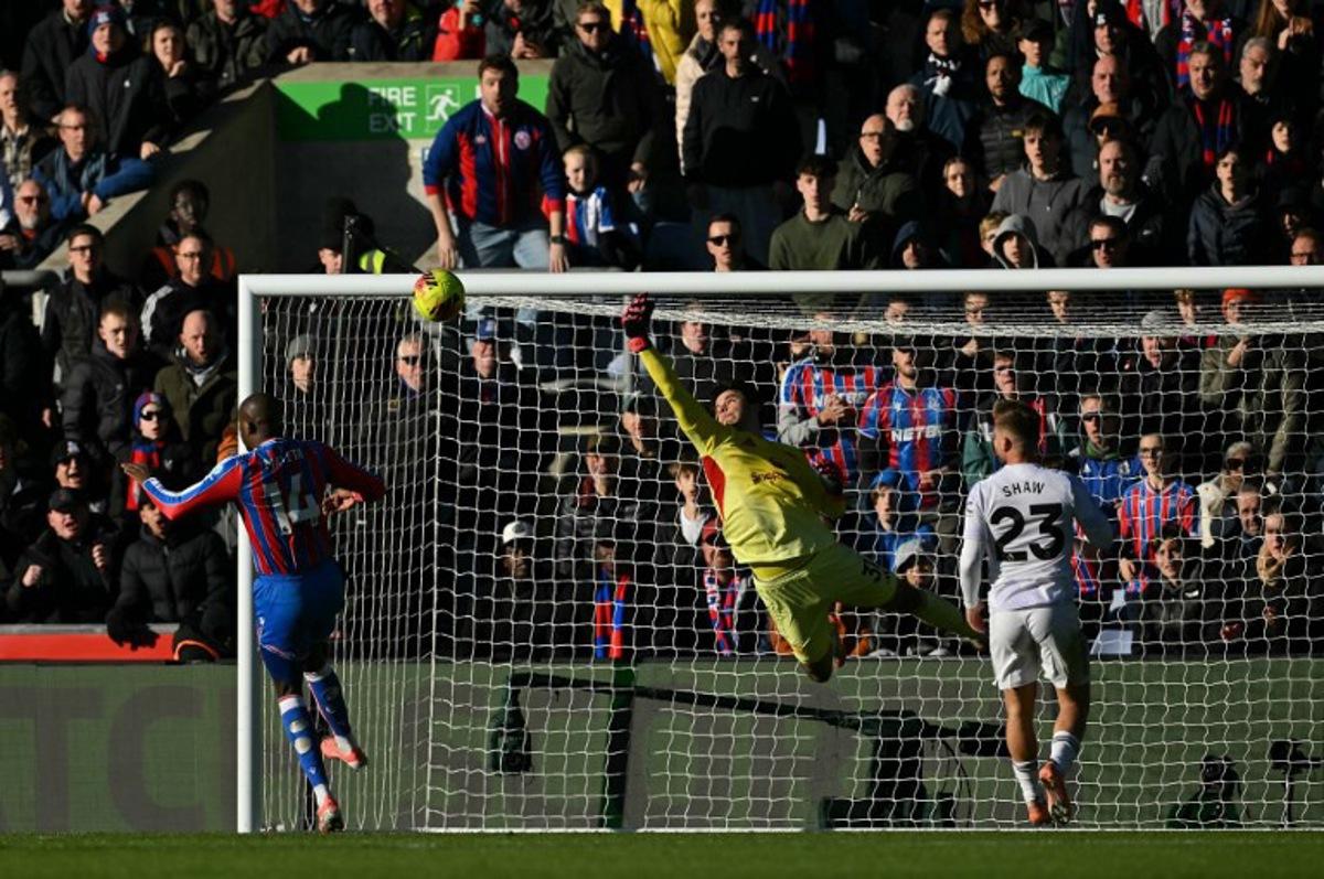 Manchester United's Belgian goalkeeper #31 Senne Lammens makes a save during the English Premier League football match between Crystal Palace and Manchester United at Selhurst Park in south London on November 30, 2025. Glyn KIRK / AFP