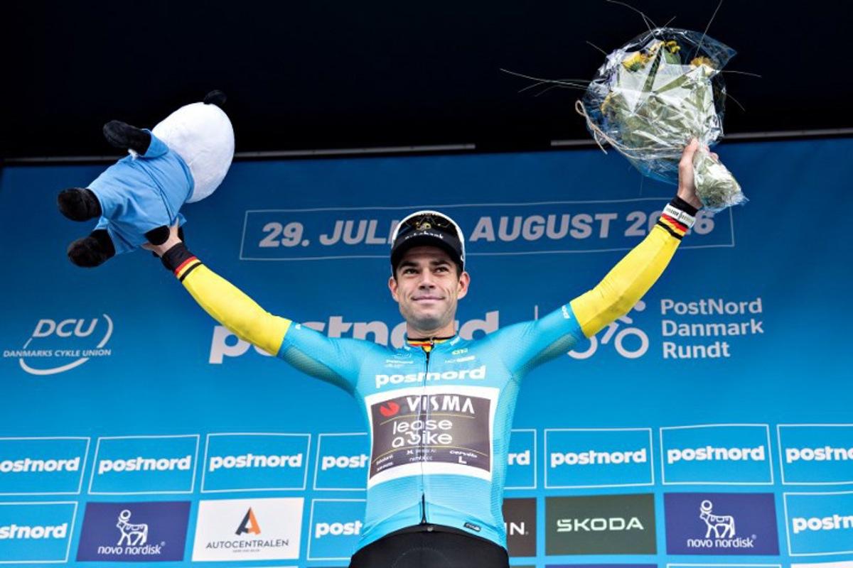 UCI WorldTeam Visma-Lease a Bike's Belgian rider Wout Van Aert celebrates winning on the podium after the 3rd stage of the PostNord Denmark Tour on July 31, 2026 in Fredericia, Denmark. Henning Bagger / Ritzau Scanpix / AFP