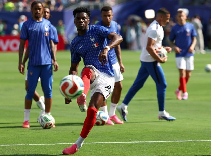 France's midfielder #08 Aurelien Tchouameni warms up ahead of the 2026 World Cup round of 32 football match between France and Sweden at the New York/New Jersey Stadium in East Rutherford on June 30, 2026. FRANCK FIFE / AFP