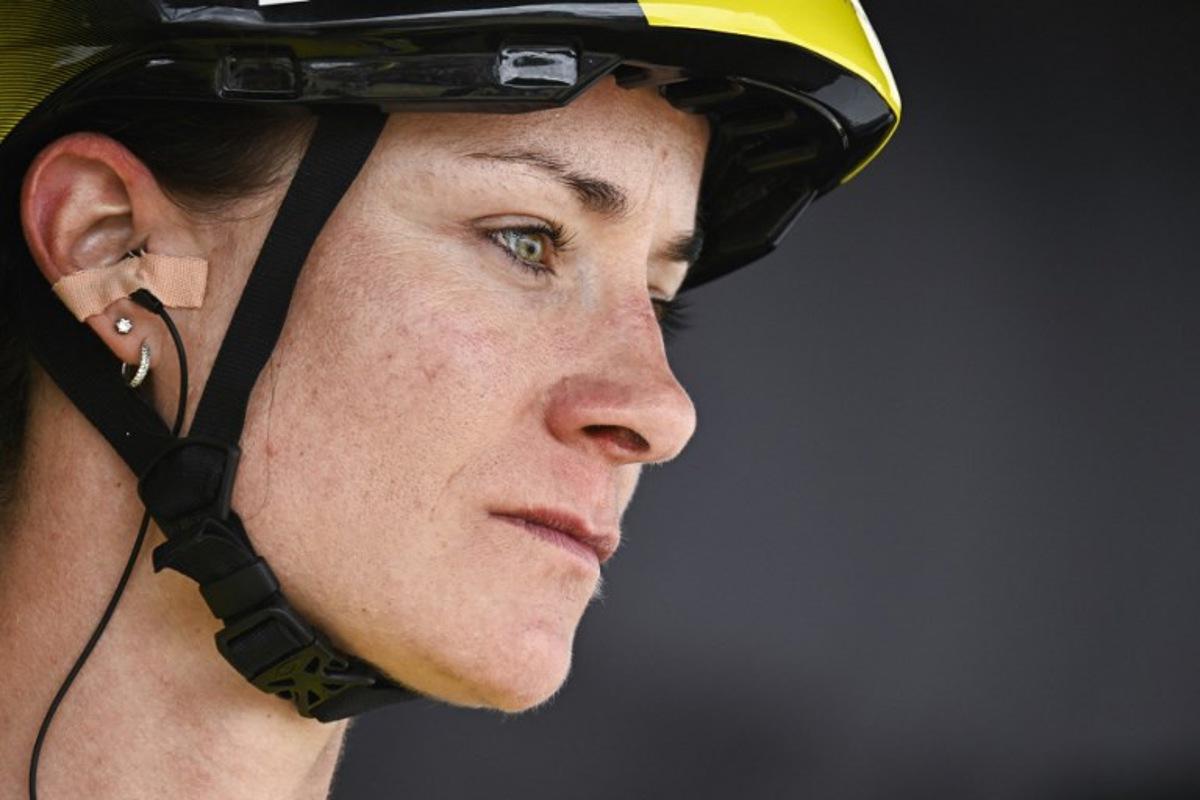 Team Visma | Lease a Bike's Dutch rider Marianne Vos wearing the overall leader's yellow jersey awaits the start of the 5th stage (out of 9) of the fourth edition of the Women's Tour de France cycling race, 165.8 km from Chasseneuil-du-Poitou to Gueret, central France on July 30, 2025. JULIEN DE ROSA / AFP