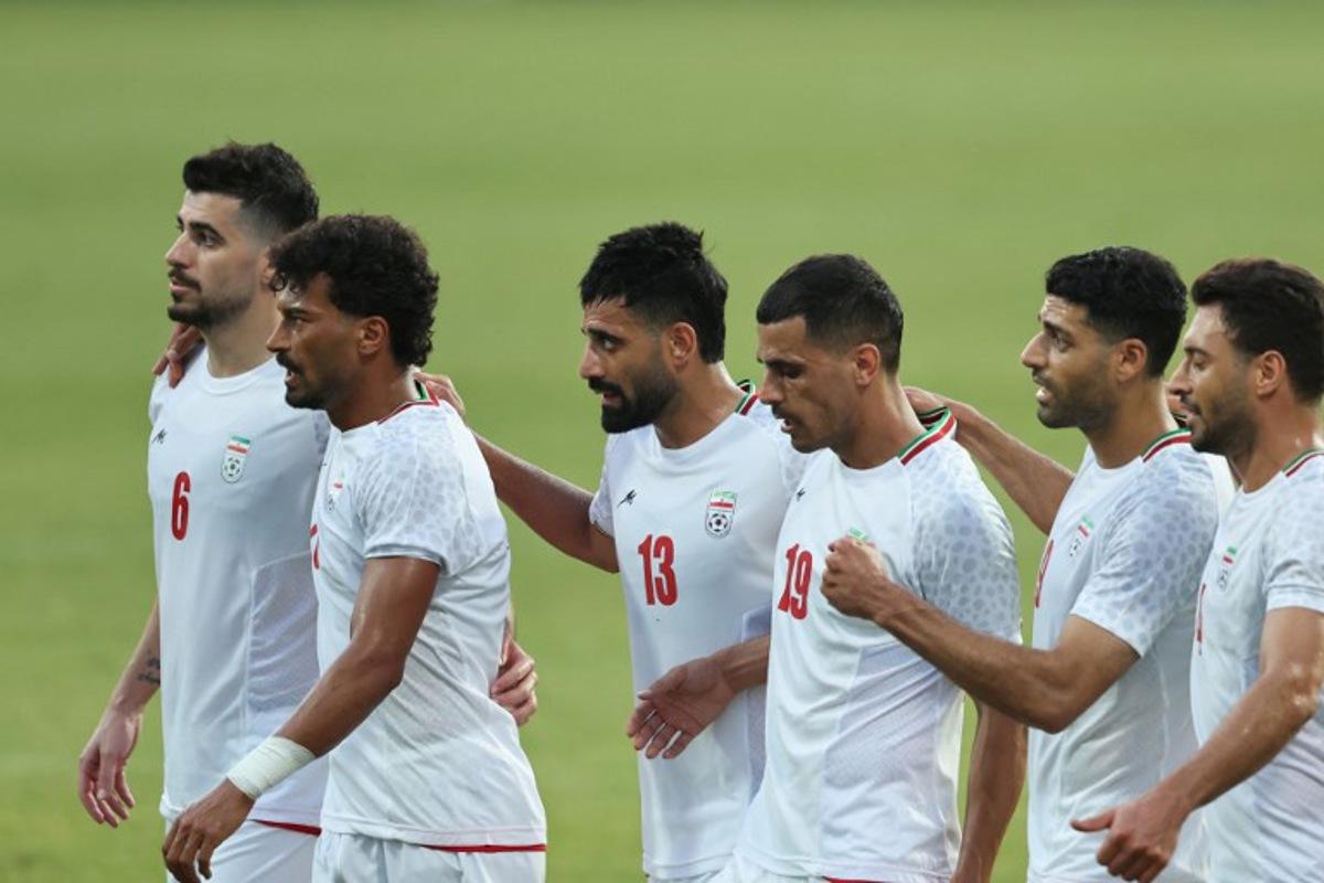 Iran's Forward #23 Ramin Rezaeian celebrates with teammates after scoring their side's second goal during an international friendly football match between Iran and Gambia, in Antalya, southern Turkey, May 29, 2026, as part of Iran's preparation for the upcoming football World Cup. Oner SAN / AFP