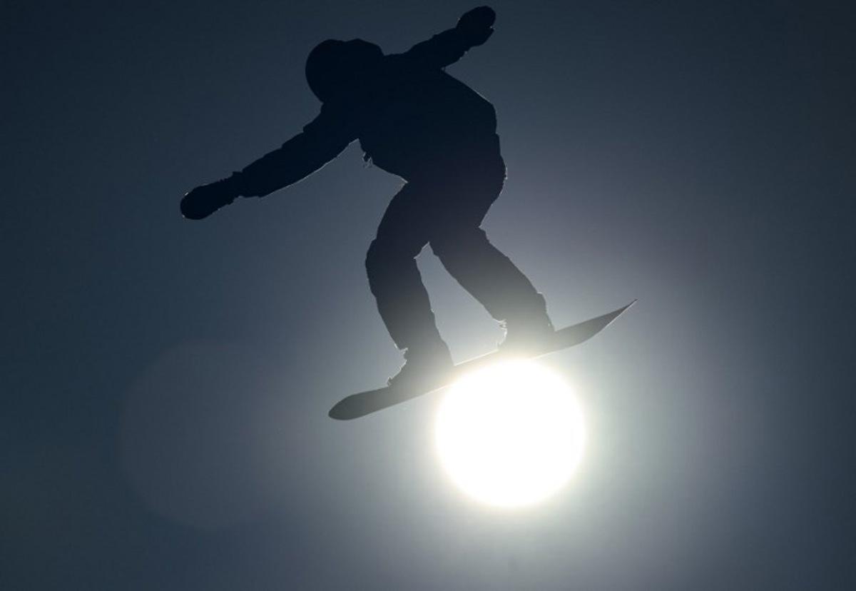 This handout photo taken and received from the OIS/IOC on January 25, 2024 shows the silhouette of Romain Allemand of France competing in the Snowboard Men's Slopestyle during the Gangwon 2024 Winter Youth Olympic Games in Gangwon. Jonathan NACKSTRAND / OIS/IOC / AFP