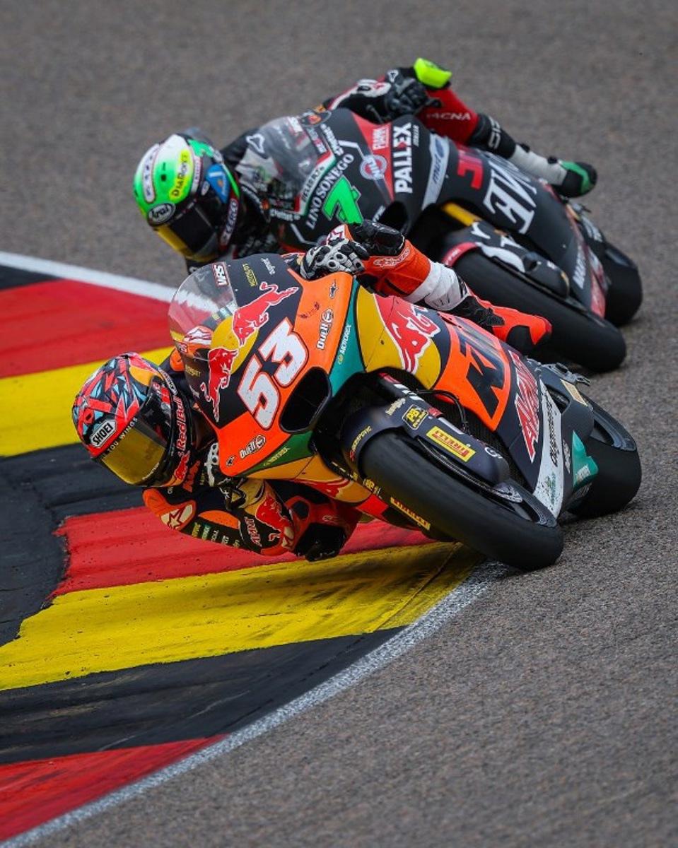 Red Bull KTM Ajo Team's Turkish Moto2 rider Deniz Oncu (front) leads next to Fantic Racing Team's Belgiums Moto2 rider Barry Baltus during the German Moto2 Grand Prix at the Sachsenring racing circuit, in Hohenstein-Ernstthal near Chemnitz, eastern Germany on July 13, 2025. Ronny Hartmann / AFP