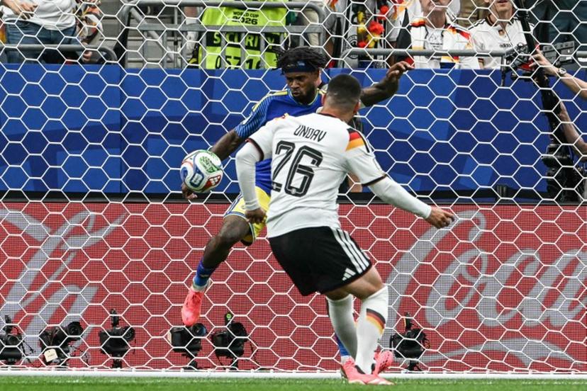 Germany's forward #26 Deniz Undav (R) scores his team's sixth goal during the 2026 World Cup Group E football match between Germany and Curacao at the Houston Stadium in Houston on June 14, 2026. RONALDO SCHEMIDT / AFP