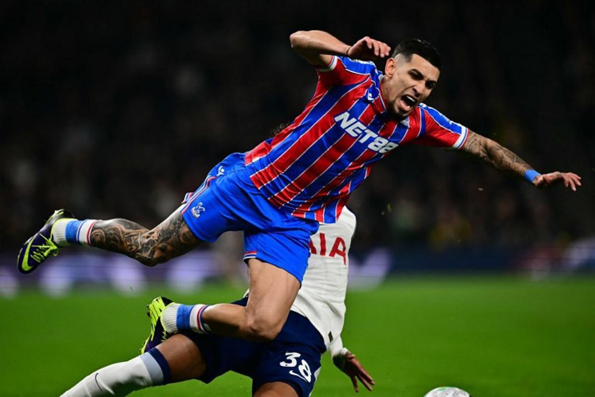 Crystal Palace's Colombian defender #02 Daniel Munoz is tackled by Tottenham Hotspur's Brazilian defender #38 Joao Victor de Souza Menezes during the English Premier League football match between Tottenham Hotspur and Crystal Palace at the Tottenham Hotspur Stadium in London, on March 5, 2026. Ben STANSALL / AFP