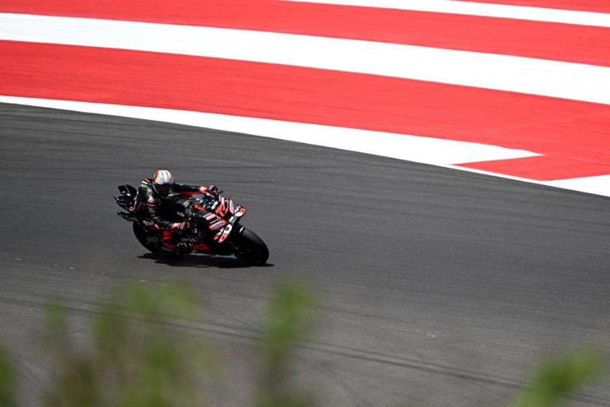 Aprilia Racing team's Italian MotoGP rider Marco Bezzecchi rides during the qualifying session ahead of the MotoGP Indonesian Grand Prix at the Mandalika International Circuit in Mandalika, West Nusa Tenggara on October 4, 2025. SONNY TUMBELAKA / AFP