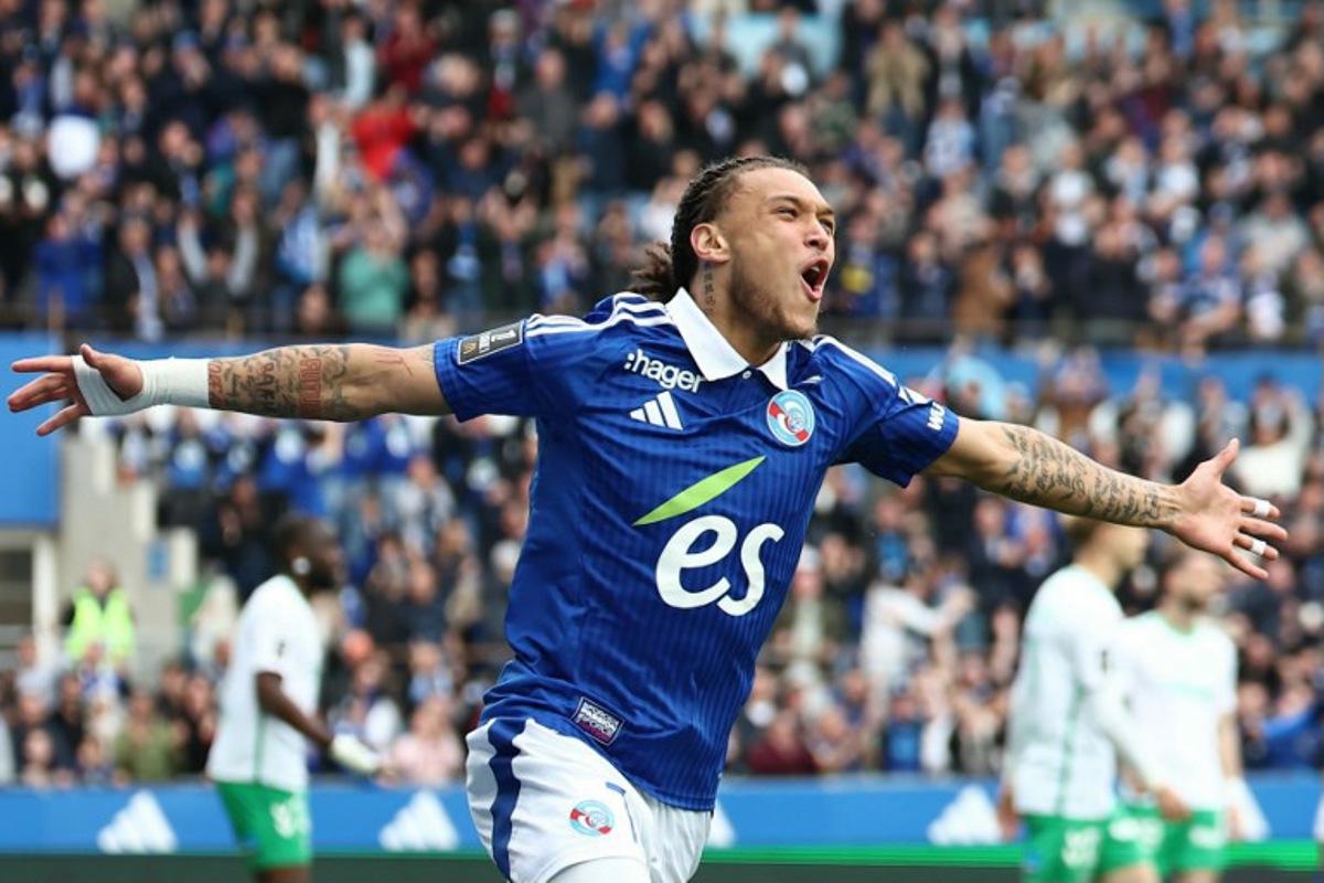 Strasbourg's Belgian-Portuguese forward #07 Diego Moreira celebrates after scoring a goal during the French L1 football match between RC Strasbourg Alsace and AS Saint-Etienne at Stade de la Meinau in Strasbourg, north-eastern France on April 26, 2025. Frederick FLORIN / AFP