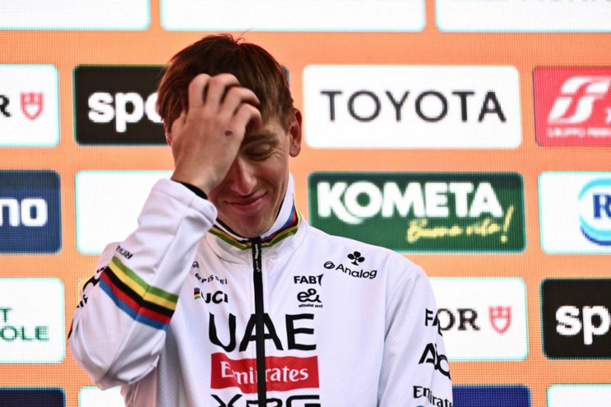 Team UAE's Slovenian rider Tadej Pogacar, third, during the podium ceremony of the Milan - Sanremo one-day classic cycling race, on March 22, 2025. Dutch Mathieu Van Der Poel of team Alpecin-Deceuninck won the race ahead of Team Ineos' Italian rider Filippo Ganna and Team UAE's Slovenian rider Tadej Pogacar, third. Marco BERTORELLO / AFP