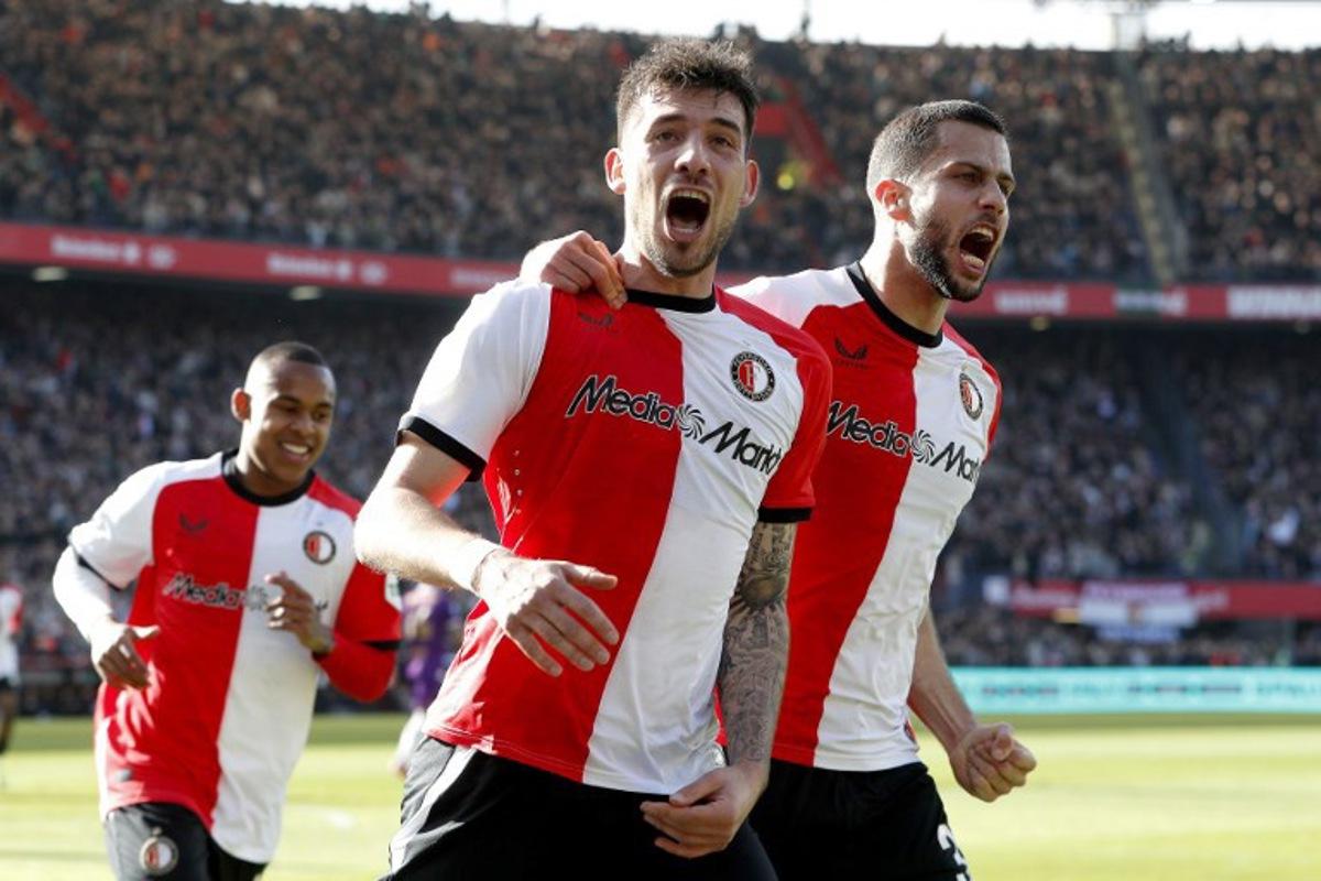 Feyenoord's Polish defender #07 Jakub Moder (C) celebrates after scoring a penalty kick for the opening goal during the Dutch Eredivisie football match between Feyenoord Rotterdam and Go Ahead Eagles at Feyenoord Stadium 'De Kuip' in Rotterdam on March 30, 2025. Jeroen Putmans / ANP / AFP