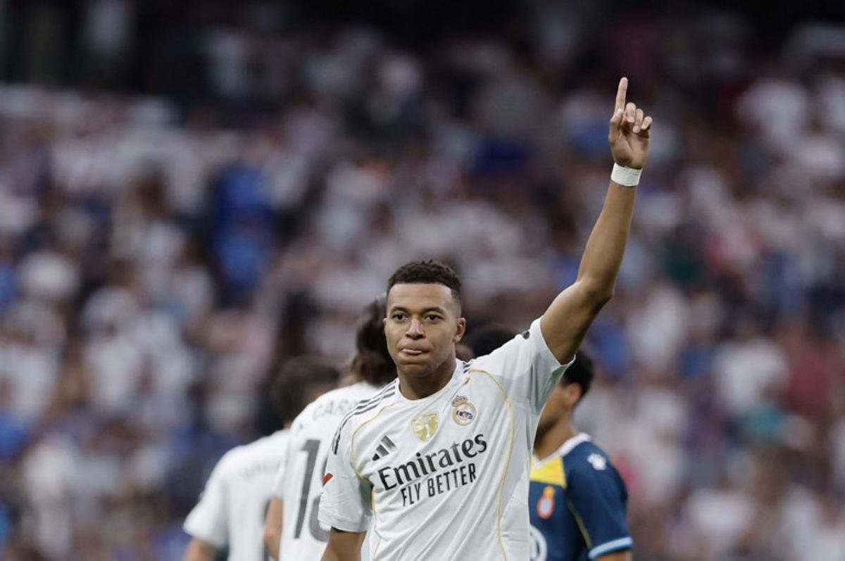 Real Madrid's French forward #10 Kylian Mbappe celebrates after scoring their second goal during the Spanish league football match between Real Madrid CF and RCD Espanyol at the Santiago Bernabeu stadium in Madrid on September 20, 2025. Oscar DEL POZO / AFP