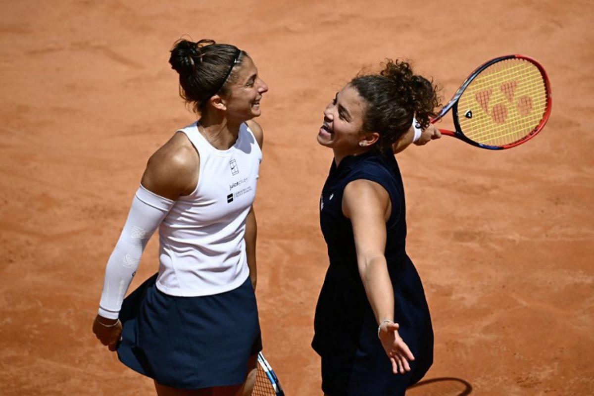 Italy's Jasmine Paolini (r) and Sara Errani (l) celebrate at the end of their women's doubles final match against Russia's Veronika Kudermetova and Belgium's Elise Mertens for the ATP Rome Open tennis tournament at Foro Italico in Rome on May 18, 2025. Filippo MONTEFORTE / AFP