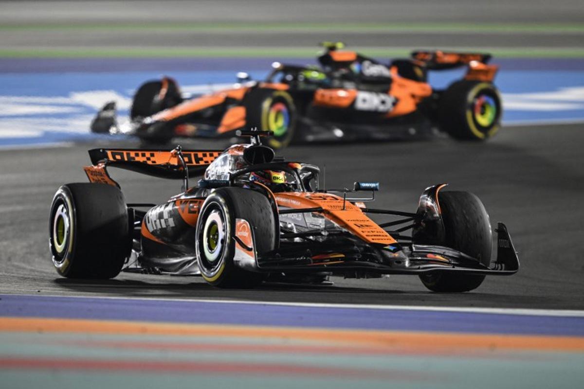 McLaren's Australian driver Oscar Piastri and McLaren's British driver Lando Norris drive during the sprint race ahead of the Formula One Qatar Grand Prix at the Lusail International Circuit in Lusail on November 29, 2025. Mahmud HAMS / AFP