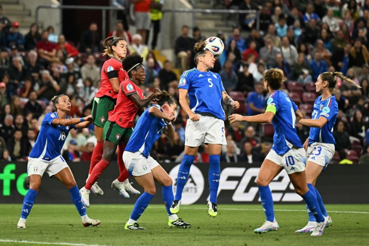Italy's defender #05 Elena Linari (C) heads the ball during the UEFA Women's Euro 2025 Group B football match between Portugal and Italy at the Stade de Geneve in Geneva, on July 7, 2025. Fabrice COFFRINI / AFP