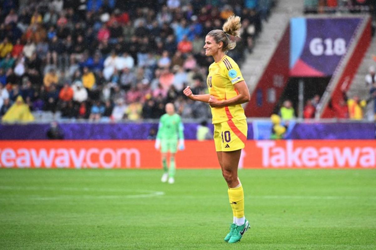 Belgium's midfielder #10 Justine Vanhaevermaet (C) celebrates after scoring her team's first goal during the UEFA Women's Euro 2025 Group B football match between Spain and Belgium at the Arena Thun stadium in Thun on July 7, 2025. SEBASTIEN BOZON / AFP