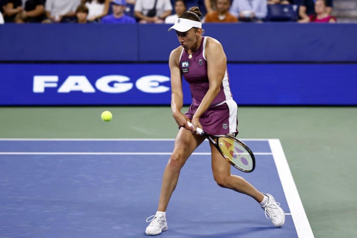 Belgium's Elise Mertens hits a return to Japan's Naomi Osaka in their women's singles third round tennis match on day seven of the US Open tennis tournament at the USTA Billie Jean King National Tennis Center in New York City on September 5, 2026. kena betancur / AFP