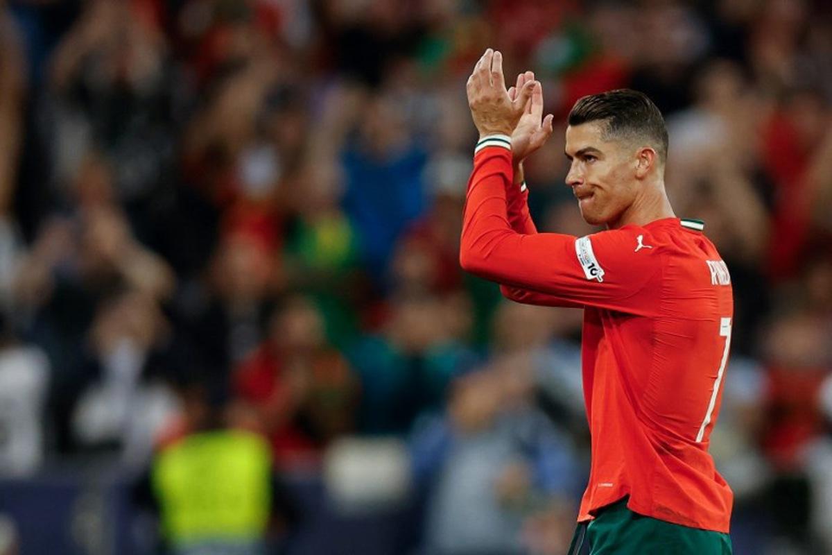 Portugal's forward #07 Cristiano Ronaldo applauds as he comes off during the UEFA Nations League semi-final football match between Germany and Portugal in Munich, southern Germany on June 4, 2025. Alexandra BEIER / AFP