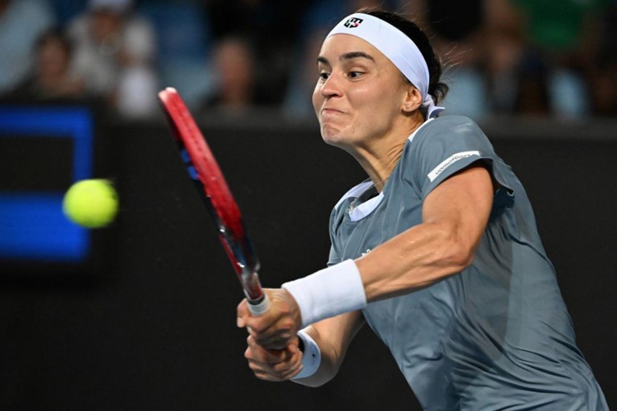 Ukraine's Anhelina Kalinina hits a shot against Tunisia's Ons Jabeur during their women's singles match on day three of the Australian Open tennis tournament in Melbourne on January 14, 2025. Paul Crock / AFP