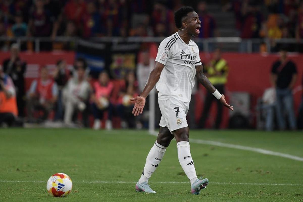 Real Madrid's Brazilian forward #07 Vinicius Junior reacts during the Spanish Cup, Copa del Rey (King's Cup) final football match between FC Barcelona and Real Madrid CF at La Cartuja stadium in Seville on April 26, 2025. Josep LAGO / AFP